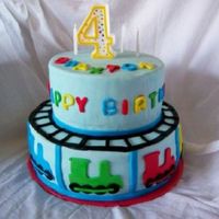 Train Cake 6" and 8" yellow cake with sprinkles baked in. Design based on one of sugarshacks creations.