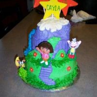 Dora Star Mountain White velvet cake with strawberry filling and frosted with vanilla buttercream and fondant accents.