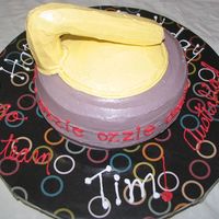 Curling Rock Vanilla cake with Chocolate filling and buttercream icing. Handle is wood dowel covered in rice cripies and covered in buttercream. Handle...