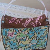 7Th Birthday Purse Vanilla cake with Bavarian Cream filling and buttercream icing. Ribbon handle.