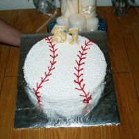 Baseball I made this cake for my husband's birthday. He loves baseball and softball adn plays both. I just "stared" the butter cream...