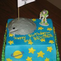 Buzz Lightyear Buzz Lightyear cake. The moon is a half round on top. All BC.