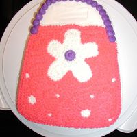 Purse Cake (Wilton Pan) This is a new pan I got and I made it for a co-worker as a belated present and she absolutely loves purses. Okay for a first time but had...