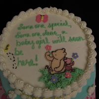 Top Of Classic Pooh Baby Shower Cake The top reads, "Someone special, someone dear, a baby girl will soon be here!"