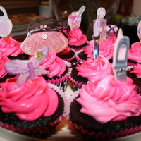 Hot Pink Girly Cupcakes Chocolate cupcakes with pink buttercream. I found stickers at the craft store and made my own cupcake toppers.