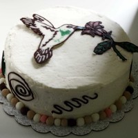 Humming Bird Cake Mocha cake with seedless raspberry filling and IBC frosting. The humming bird and other decorations are made from melted chocolate. The...