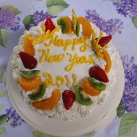 Happy New Year 2011! Ringing in the new year with a scratch sponge cake soaked with fresh strawberry juice and cherry brandy. Layered with kiwi, peaches and...