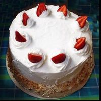 Strawberry Sponge fresh sliced strawberries, layered between cherry brandy soaked sponge cake. fresh stabilized whipped cream and roasted nuts.