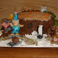 Critter Cake Stump Cake with gum paste animals and "Little Critter". The cake was all chocolate, frosted with choclate mocha,butter cream,to...