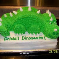 Dinosaur End of year party with class mascot theme. Base 11 x15. Dinosaur is made from halved 8 inch round, small doll skirt (head) and carved (tail...