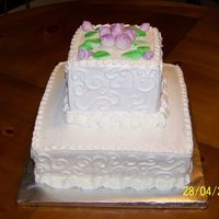 Wedding Shower Bottom tier white chocolate, top, strawberry. Buttercream icing and MMF rose buds and leaves.