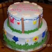 Baby Shower Girl 10" rounds Buttercream with some fondant accents. Piped baby clothing.