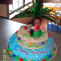 Hula Girl Birthday cake for little girl. Bottom tier 12" top, 8". Buttercream icing, crushed vanilla wafers for sand. Hula girl and tree...