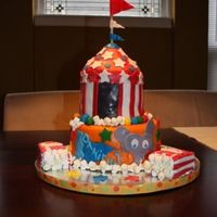 Danielle's Circus 9in round yellow cake with a vanilla buttercream, covered in fondant with fondant deco, popcorn boxes made out of rice krispie treats...