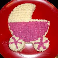 Baby Carriage I made this for a vegan friend, so the icing is kind of clumpy. I hadn't quite decided how to do the wheels before I started, so...