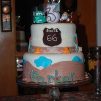 Cars Theme Cake This is a cake I threw together for my nephews 3rd birthday, he loves the movie Cars!I usually dont use plastic figures, but I was limited...