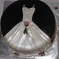 Bridal Shower Dress Cake My attempt at a design I've seen various places. :) MMF dress, gum pastes flowers and royal icing leaves.