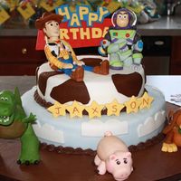 Toy Story Cake Characters and sign made out of fondant