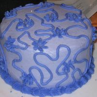 Squiggles And Flower Birthday cake using two different shades of purple.
