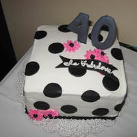40 Is Fabulous This was done for a good friends 40th BDay. Buttercream icing, the numbers were done in color flow, and the polk-a-dots are fondant.