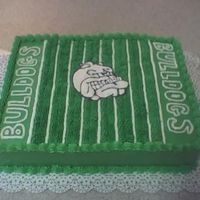 Football Cake Did this for a local kids football team, end of year party. Cake is two layers covered in buttercream, and bulldog in center is made out of...