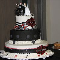 Harley Wedding This was a really unique wedding that was held in our local Harley Shop. It was traditional white and deep fudge cakes- with butter cream...