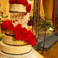 Cascading Roses 4 tier wedding cake with fresh roses.