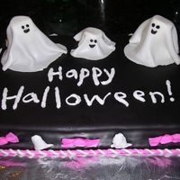 Halloween Cake For Gym Party Chocolate cake with chocolate cream filling, covered with chocolate fondant and fondant covered marshmallow ghosts