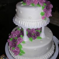 Course 3 Finale WASC with strawberry filling. Covered in MMF with gumpaste flowers and BC leaves.