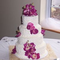 Wendy Buttercream icing, chocolate cake with whipped chocolate ganache and white cake with raspberry filling with sweetened cream.
