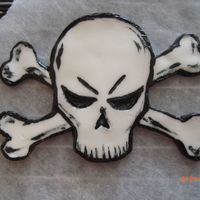 Skull Topper Gum paste w/ black americolor for rock-n-roll cake, I will post finished cake soon!!