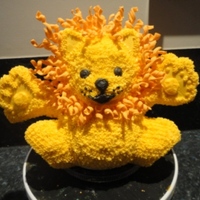 Cuddly Lion Lion from Wilton Yearbook 2011 (modified paws), vanilla pound cake with buttercream icing, cookie paws, fondant curls for mane (used the...