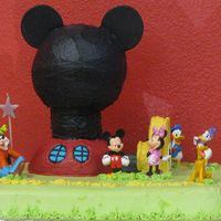 Mickey Mouse Clubhouse My daughter wanted a Mickey Mouse cake for her 3rd birthday. I used the wilton ball pan to create the clubhouse along with other pieces cut...