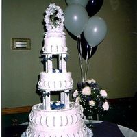 Wedding Cake My first tiered cake that I made for my sister's wedding. Ornimentation is made out of royal frosting.
