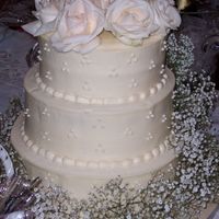 Wedding Cake W/fresh Flowers For my aunt. This is cream cheese icing on hummingbird cake. My other aunt placed the roses and baby's breath. I'm not good at...