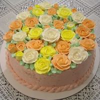 Radiant Roses Engagement Cake buttercream roses completely cover this colorful cake