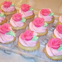 Candy Clay Rose Cupcakes For a bridal shower... white chocolate WASC cupcakes with IMBC frosting and pink candy clay roses on top.