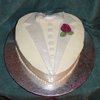 Groom Heart Cake Again, copied from a gorgeous cake by Boween. 10 inch heart with buttercream icing, fondant trim, gumpaste rose.