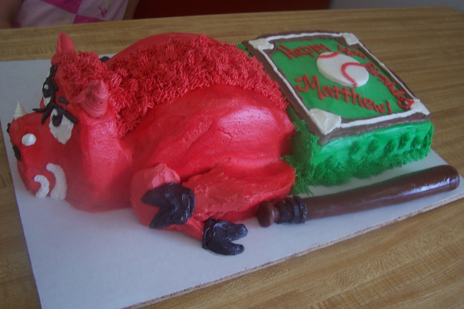 Razorback Baseball Buttercream cake with fondant bat and gumpaste baseball.