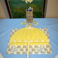 Showers Of Happiness An umbrella cake -- baked in the 18" half round pan. Cutouts on the board were just fondant cut with a cookie cutter to give me a...