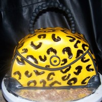 Purse This was the first purse cake I have made. For my friend Hope! German chocolate. Fondant covered, with painted spots. TYFL!