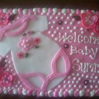 Baby Shower, White And Pink Onise Sheet cake covered in buttercream and accented with Fondant