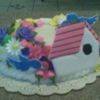 Wilton Course 2 BC basket weave and RI flowers. I am a wilton method instructor and made this for a birthday cake, the guy made bird house for a hobby.