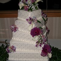 Kellys Cake 5 tiered cake, 14,12,10,8,6 All buttercream with real flowers. Quilting pattern with silver dragees. Had a great time making this cake,went...