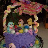 100_0499.jpg Easter Basket Cake: Handle is marshmellow. Entire cake is edible with the exception of the bow and butterfly