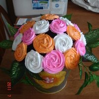 Cupcake Bouquet 24 mini cupcakes make up this fun bouquet. It's funny how people never want to take it apart and eat it! Roses were made using a...