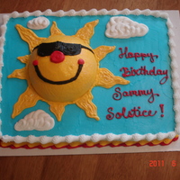 Summer Solstice This cake was done for a little boy that was born on the summer solstice last year. The sun was made by using half of the wilton ball...