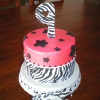 My Daughters B-Day Cake edible image zebra print patern i ordered from Abakersplace.comawesome site :)
