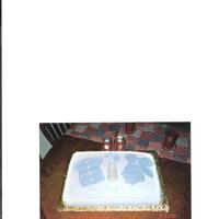 Baby Sweater And Onsie On Blanket 