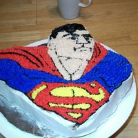 Superman Cake White cake flavoerd with coconut creamer and buttercream dream icing.